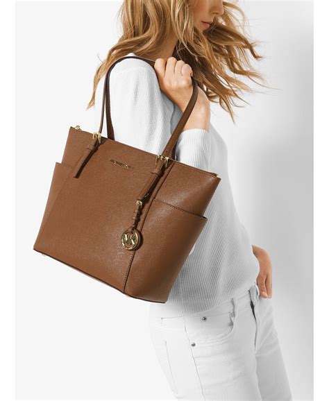 michael michael kors jet set east west top zip tote|Michael Kors saffiano tote bag.